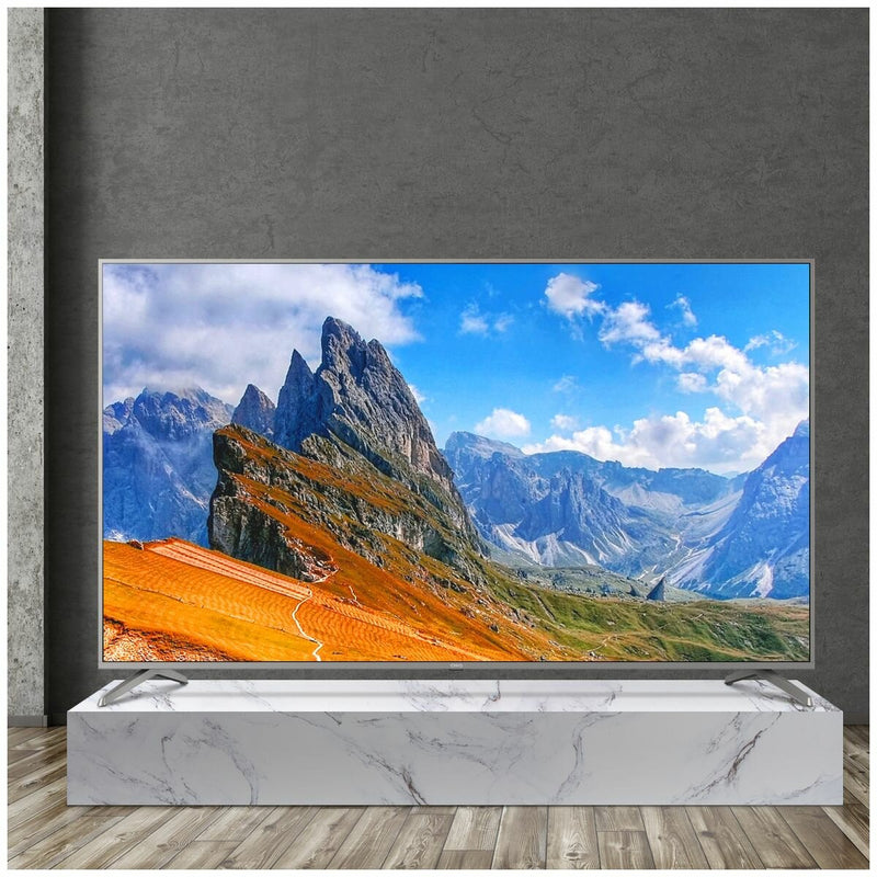 Frameless Smart Android TV in gray wall background